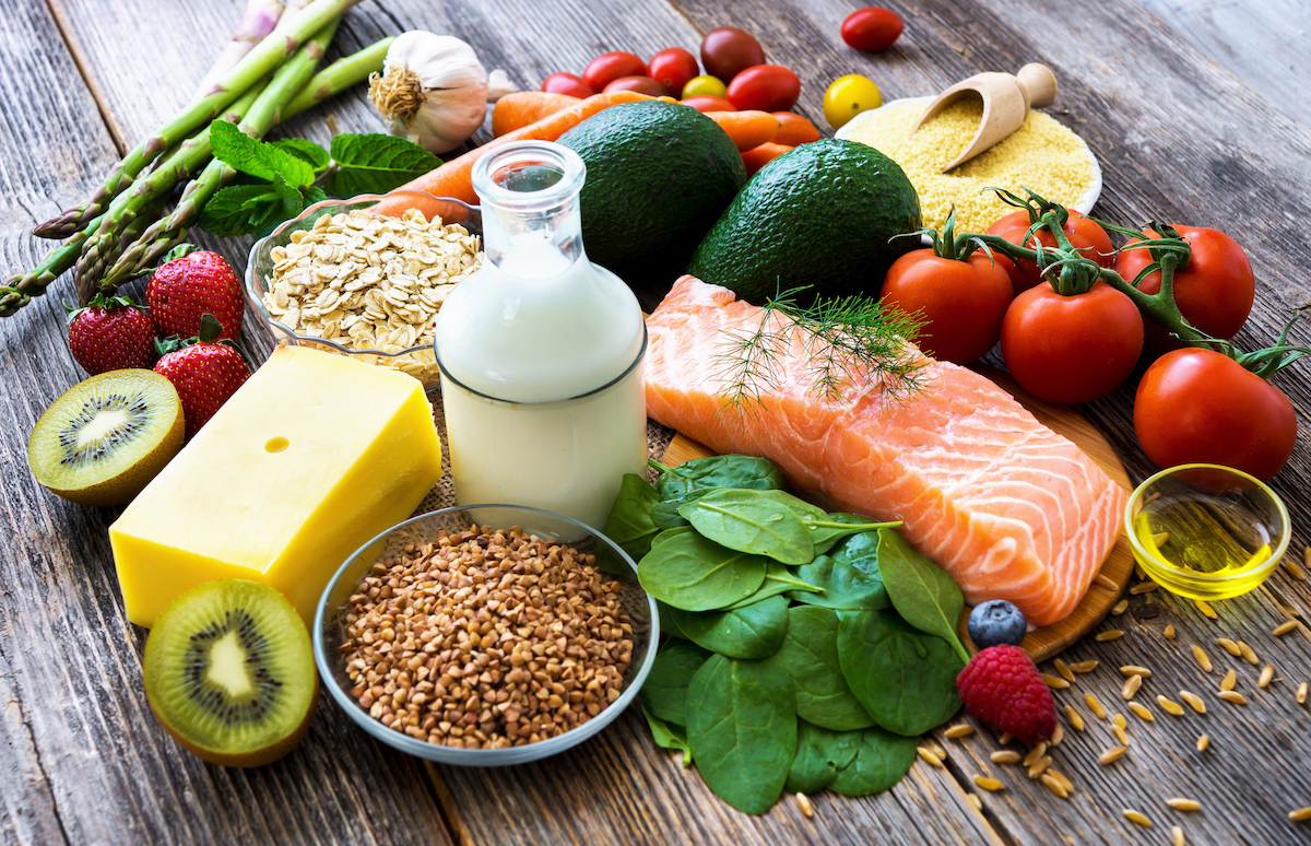 Selection of healthy food on rustic wooden background